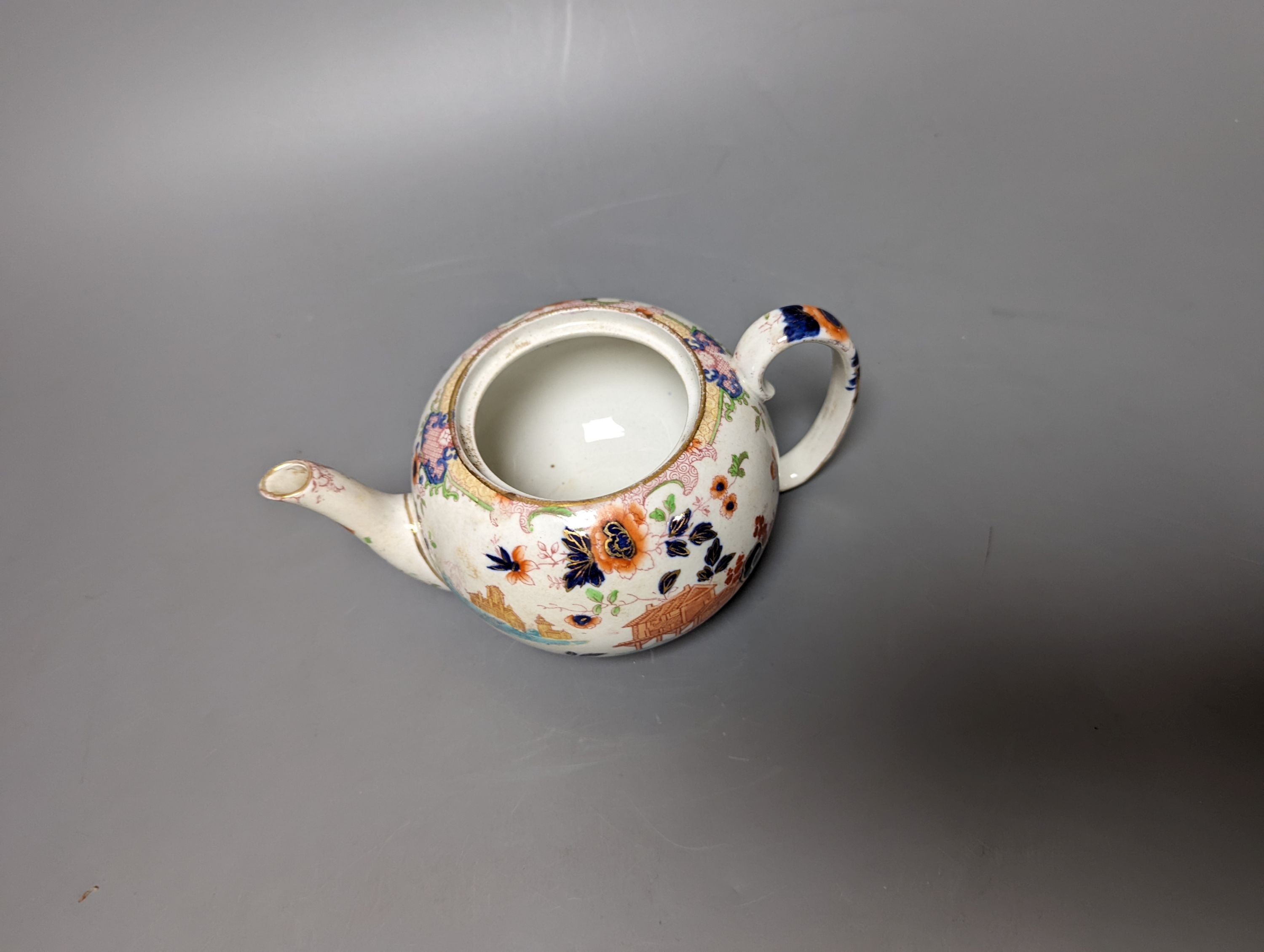 A 19th century French bisque classical female figure, Doulton Imari style teapot and a figure of an SPM porcelain figure of a Chinese man, base marked ‘SPM’. Tallest 34cm